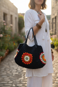 Dark Granny Square Handbag on person